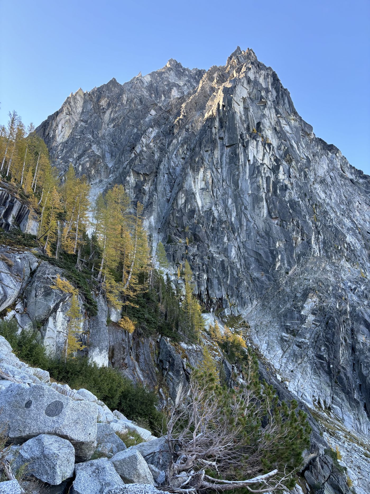 Granite peak and larch trees in the North Cascades near Bellingham, WA